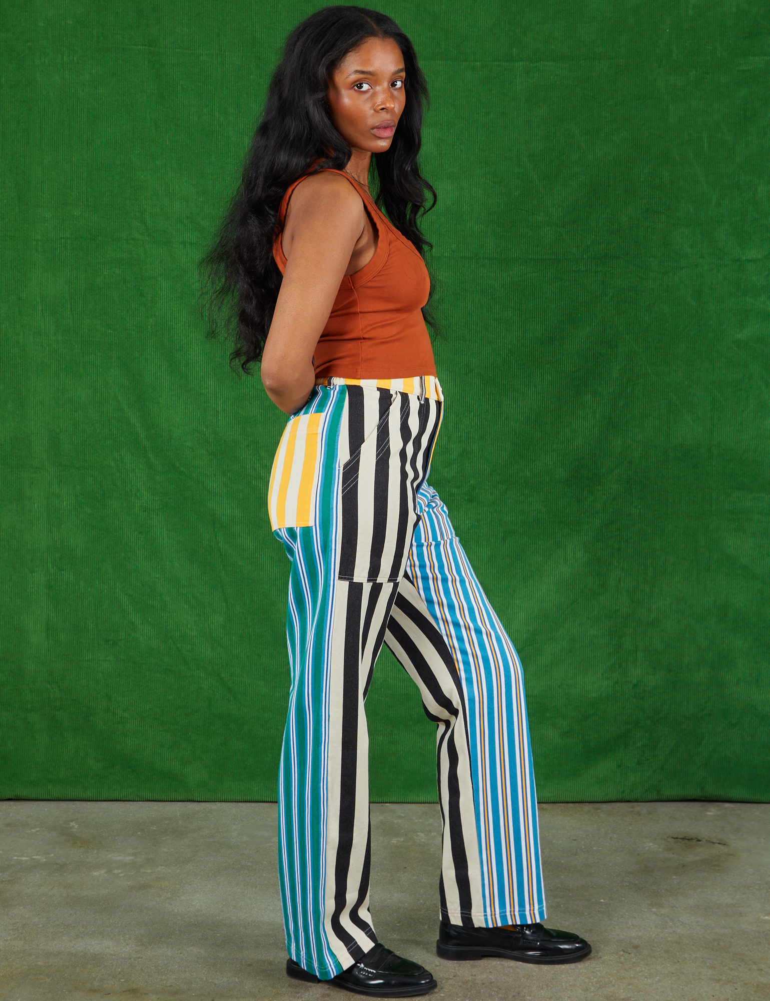 Side view of Mismatched Stripe Work Pants and burnt terracotta on Kandia