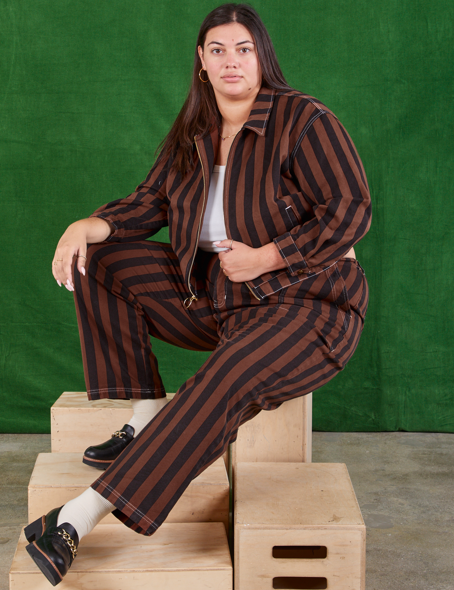 Katie is wearing Black Stripe Work Pants in Fudgesicle Brown and matching Ricky Jacket