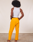 Back view of Cropped Rolled Cuff Sweatpants in Mustard Yellow on Jerrod