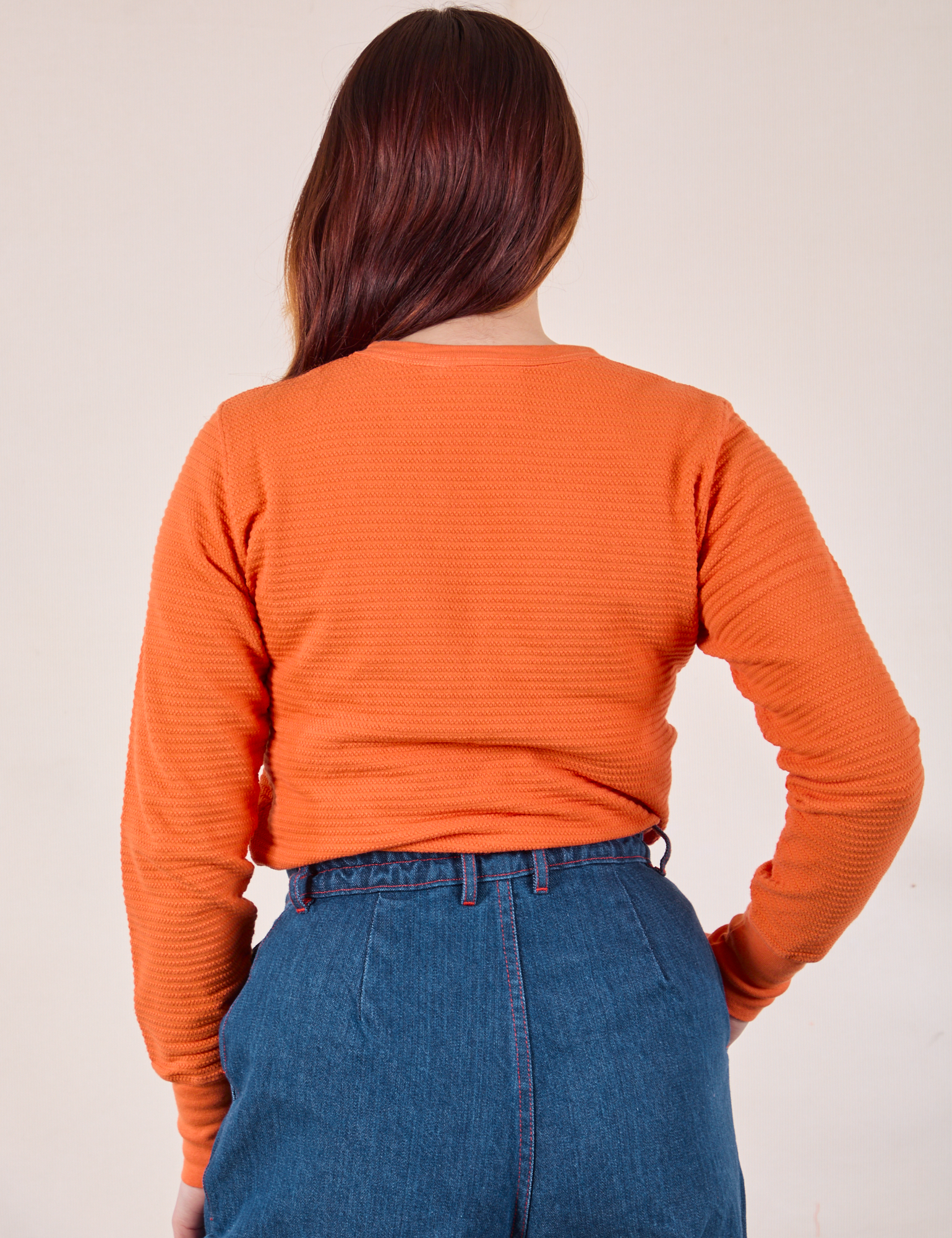 Back view of Honeycomb Thermal in Construction Orange on Betty