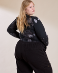 Long Sleeve Baby Tee in Ink Blot angled back view on Juliet