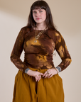 Sydney is 5'9" and wearing XXS Long Sleeve Baby Tee in Honey Brown