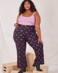 Morgan is 5'5" and wearing 1XL Western Pants in Purple Tile Jacquard paired with bubblegum pink Cami