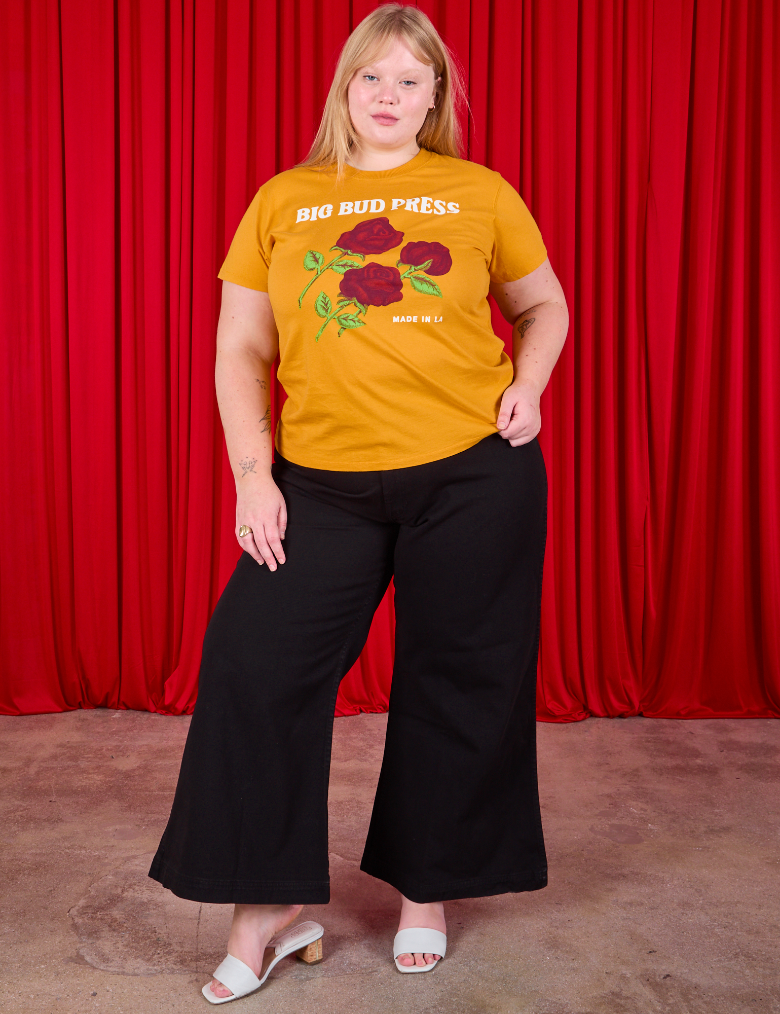 Juliet is wearing 3 Roses Organic Tee and black Bell Bottoms