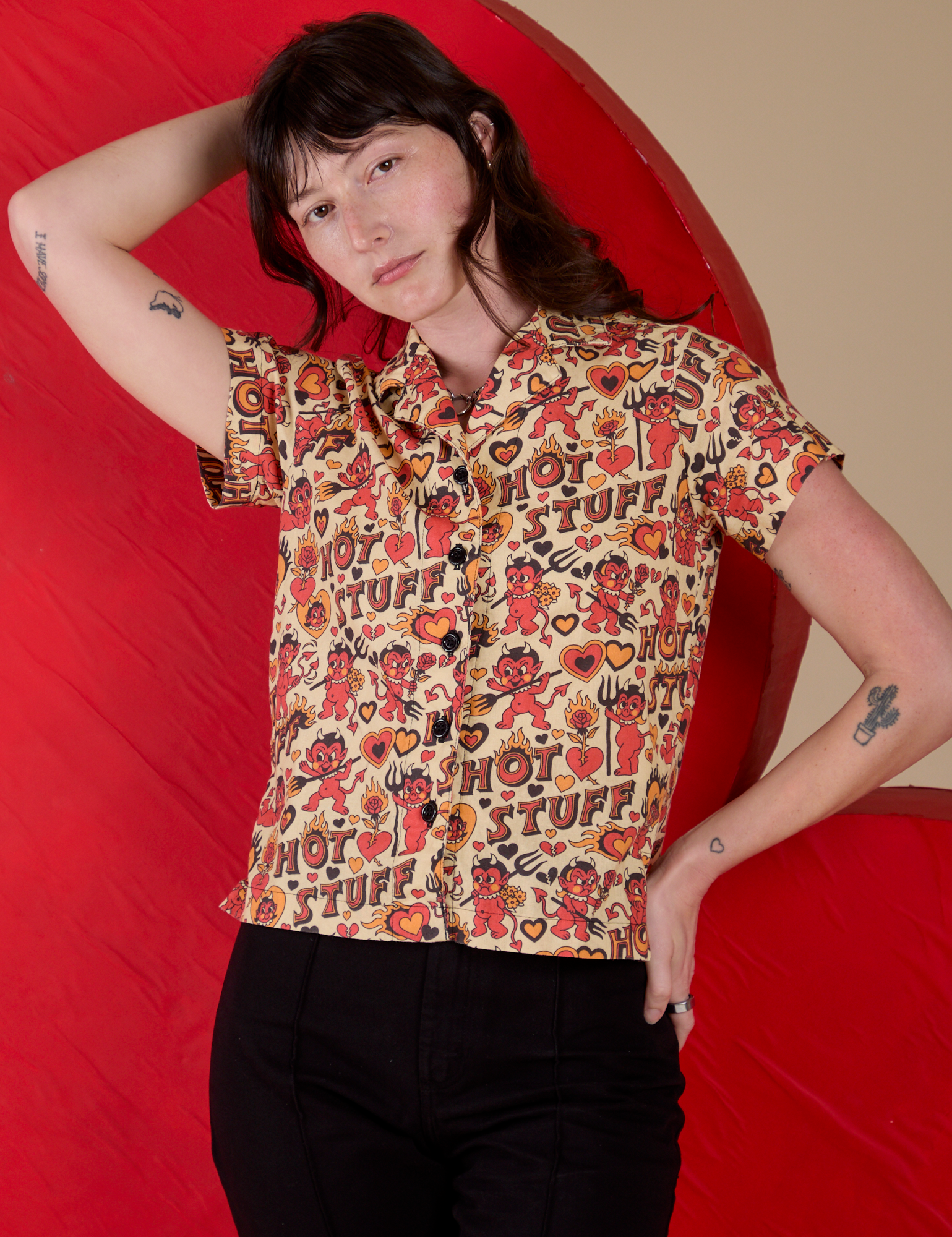 Alex is wearing a buttoned up Hot Stuff Print Pantry Button-Up