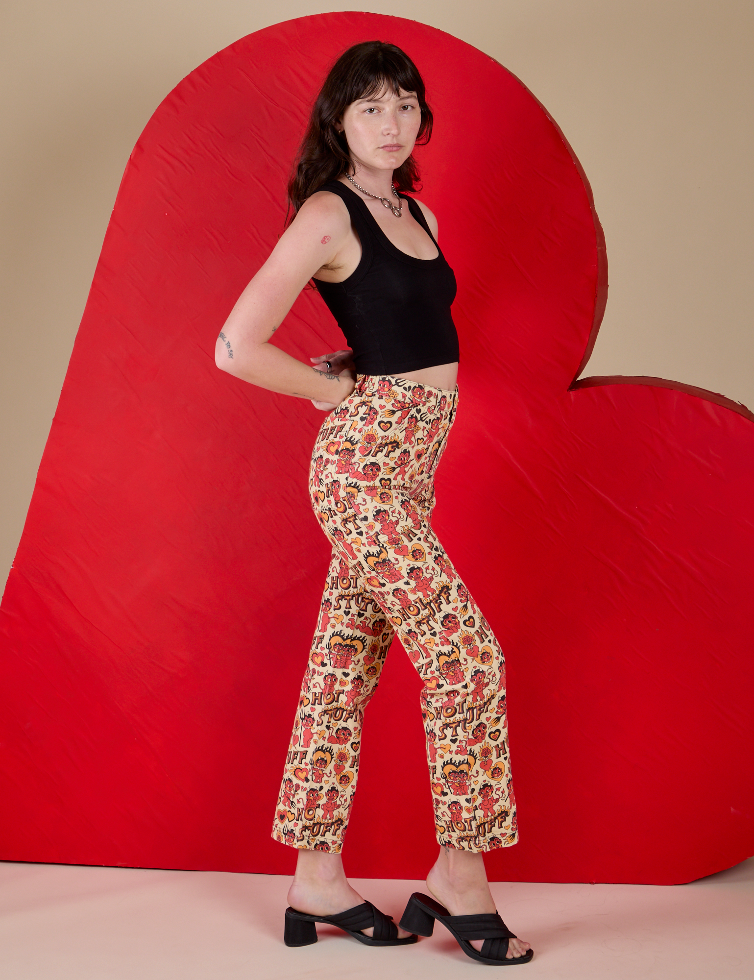 Work Pants in Hot Stuff Print and black Cropped Tank side view on Alex