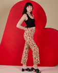 Work Pants in Hot Stuff Print and black Cropped Tank side view on Alex