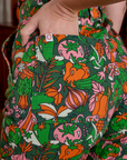 Close up of Alex's hand in the back pocket of Short Sleeve Jumpsuit in Kitchen Collection