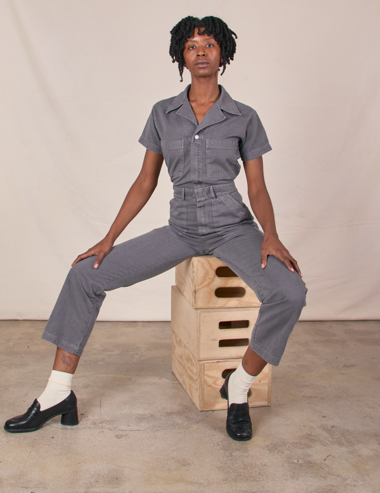 Cheyann is wearing Short Sleeve Jumpsuit in Washed Grey