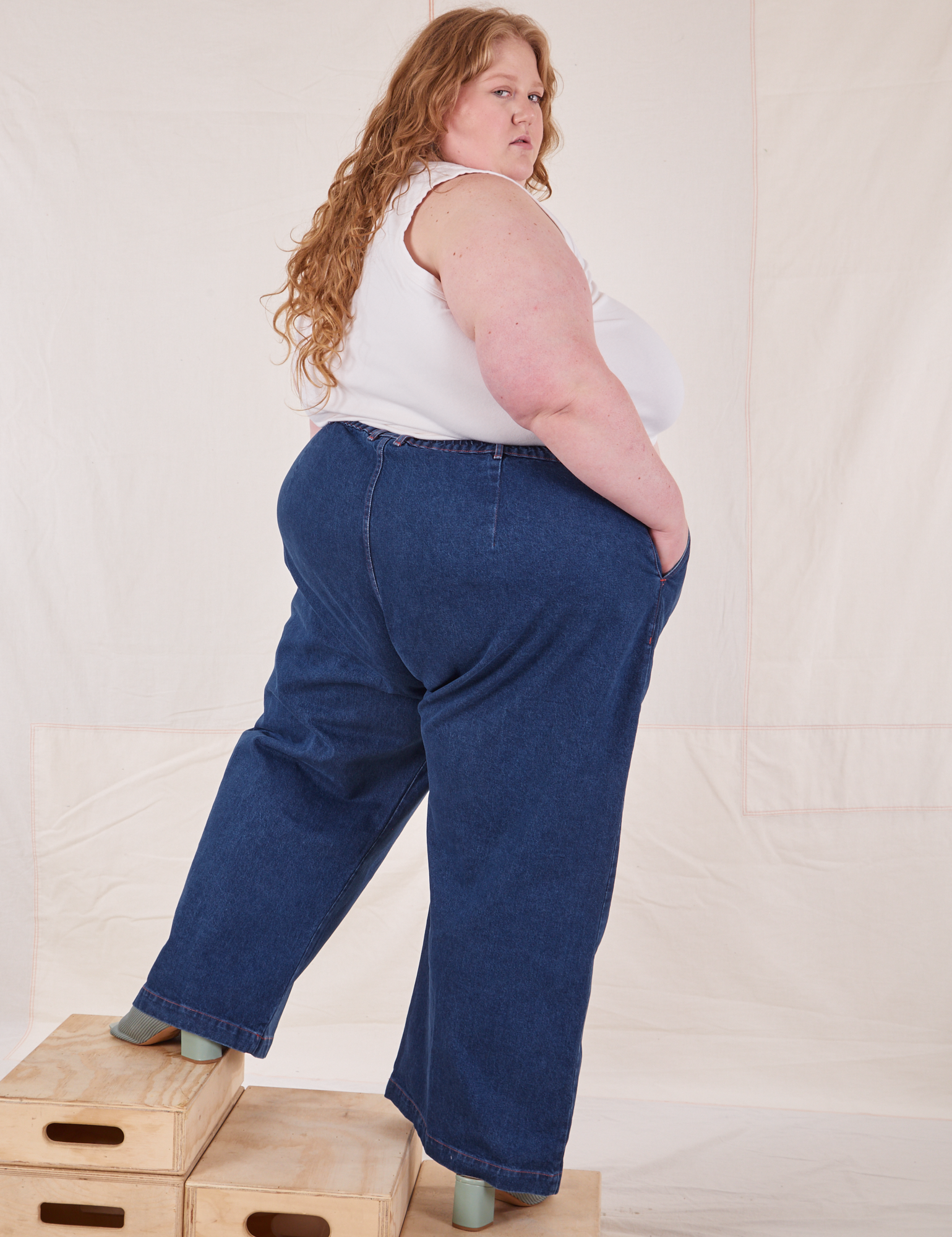 Back view of Indigo Wide Leg Trousers in Dark Wash on Catie