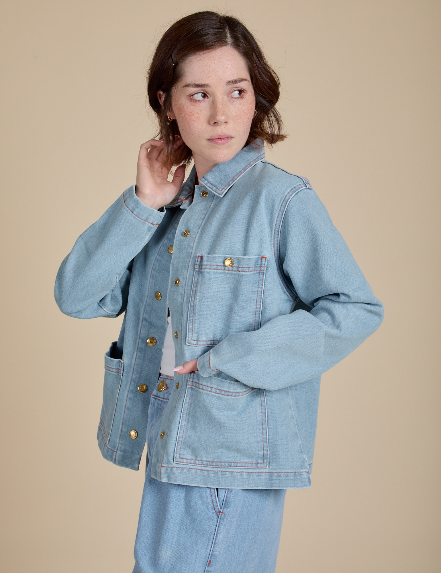 Angled front view of Indigo Denim Work Jacket in Light Wash on Hana