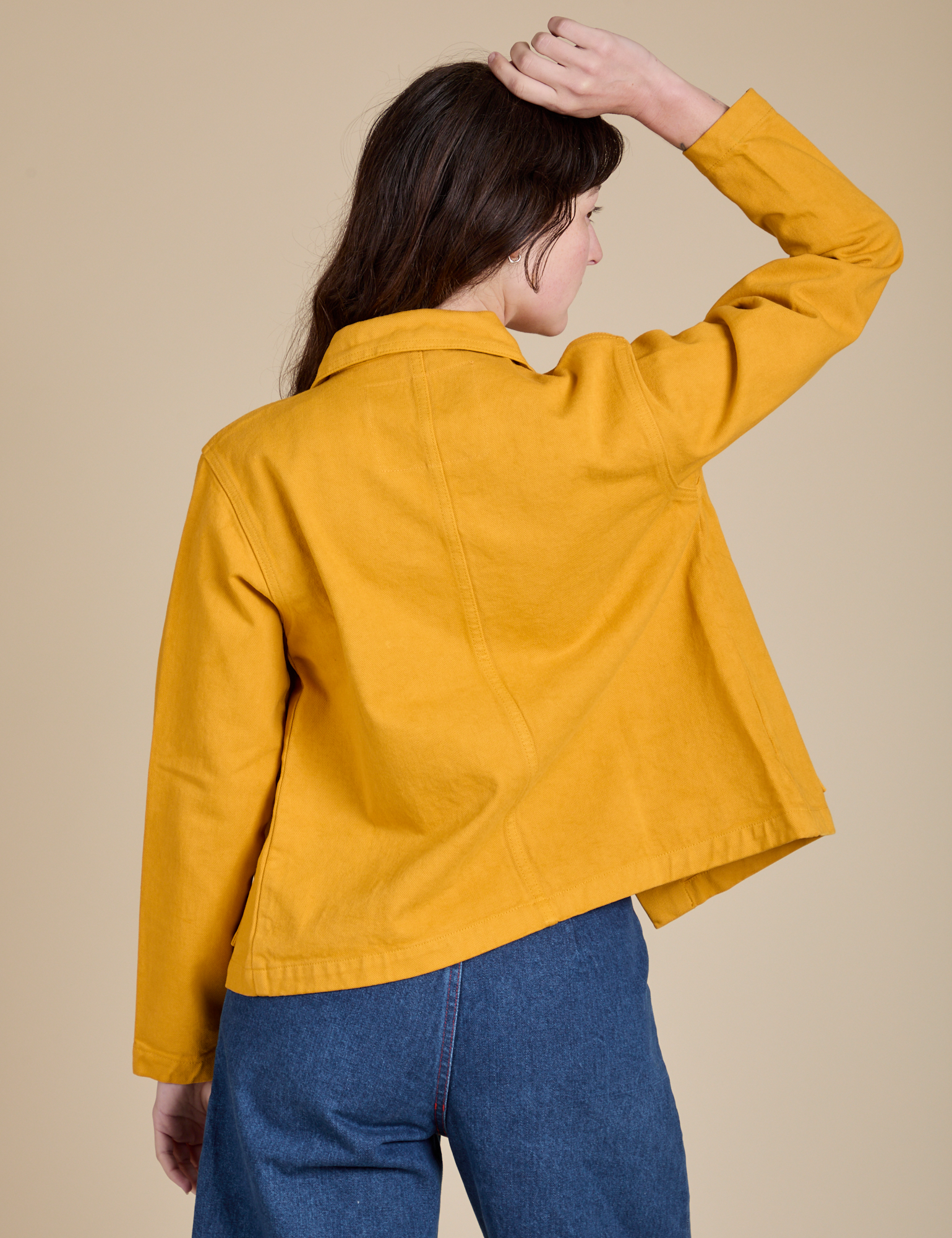 Denim Work Jacket in Mustard Yellow back view on Alex