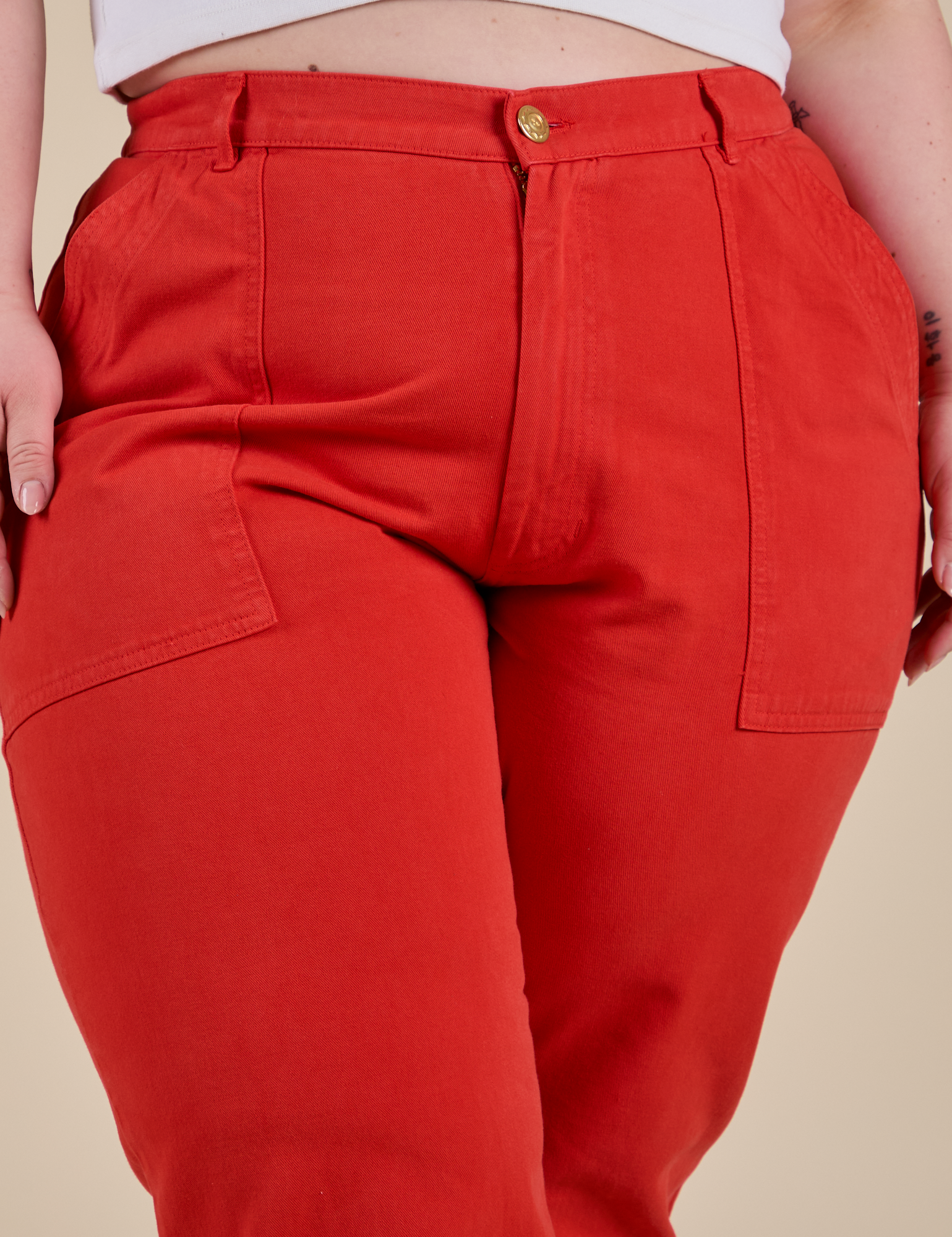 Work Pants in Mustang Red front close up on Ashley