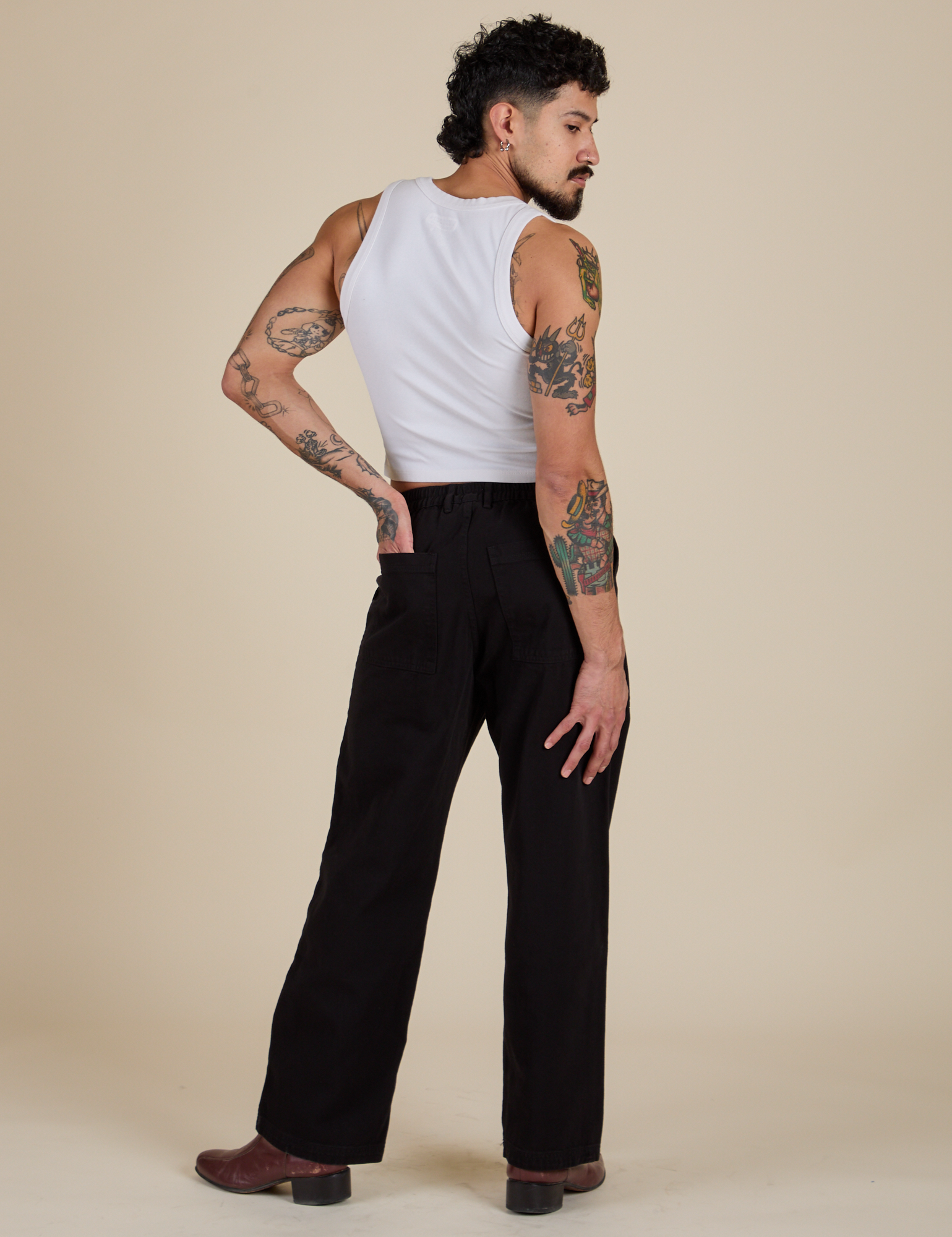 Back view of Work Pants in Basic Black and vintage tee white Cropped Tank