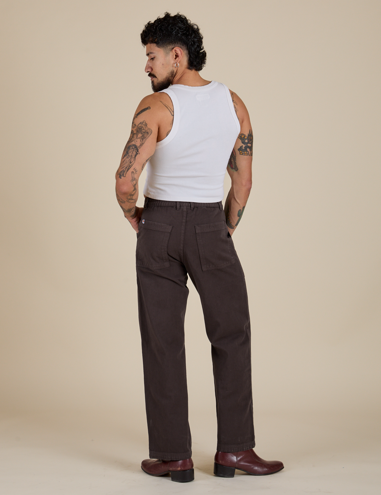 Back view of Work Pants in Espresso Brown and vintage tee white Cropped tank on Jesse