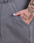 Close up of Sam's hand in the front pocket of Work Pants in Washed Grey
