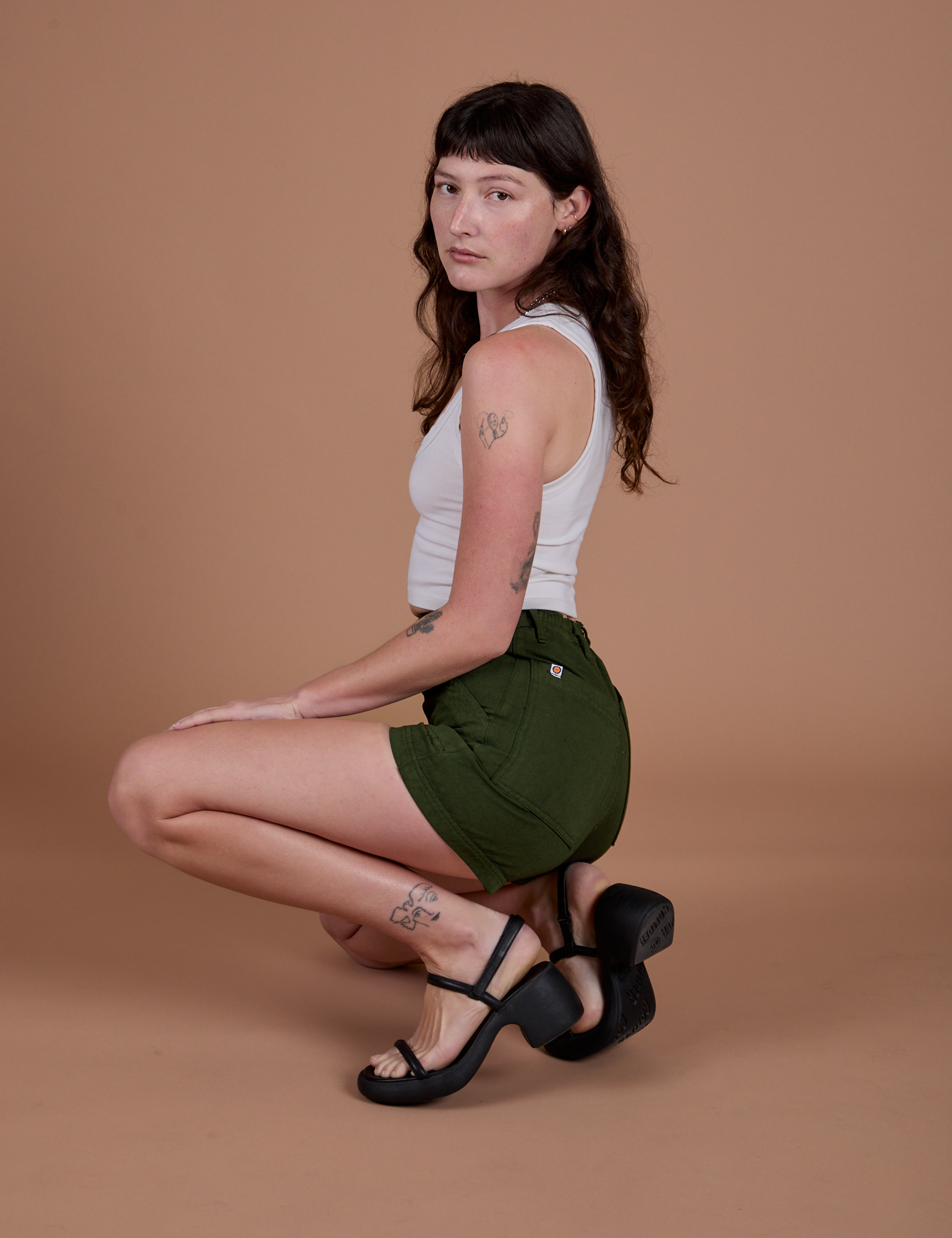 Side view of Classic Work Shorts in Evergreen and Cropped Tank in Vintage Tee White on Alex