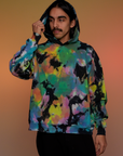 Oversized Hoodie in Rainbow Magic Waters worn on Anthony with the hood on