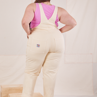 Back view of Rainbow Overalls and bubblegum pink Cropped Tank Top on Marielena