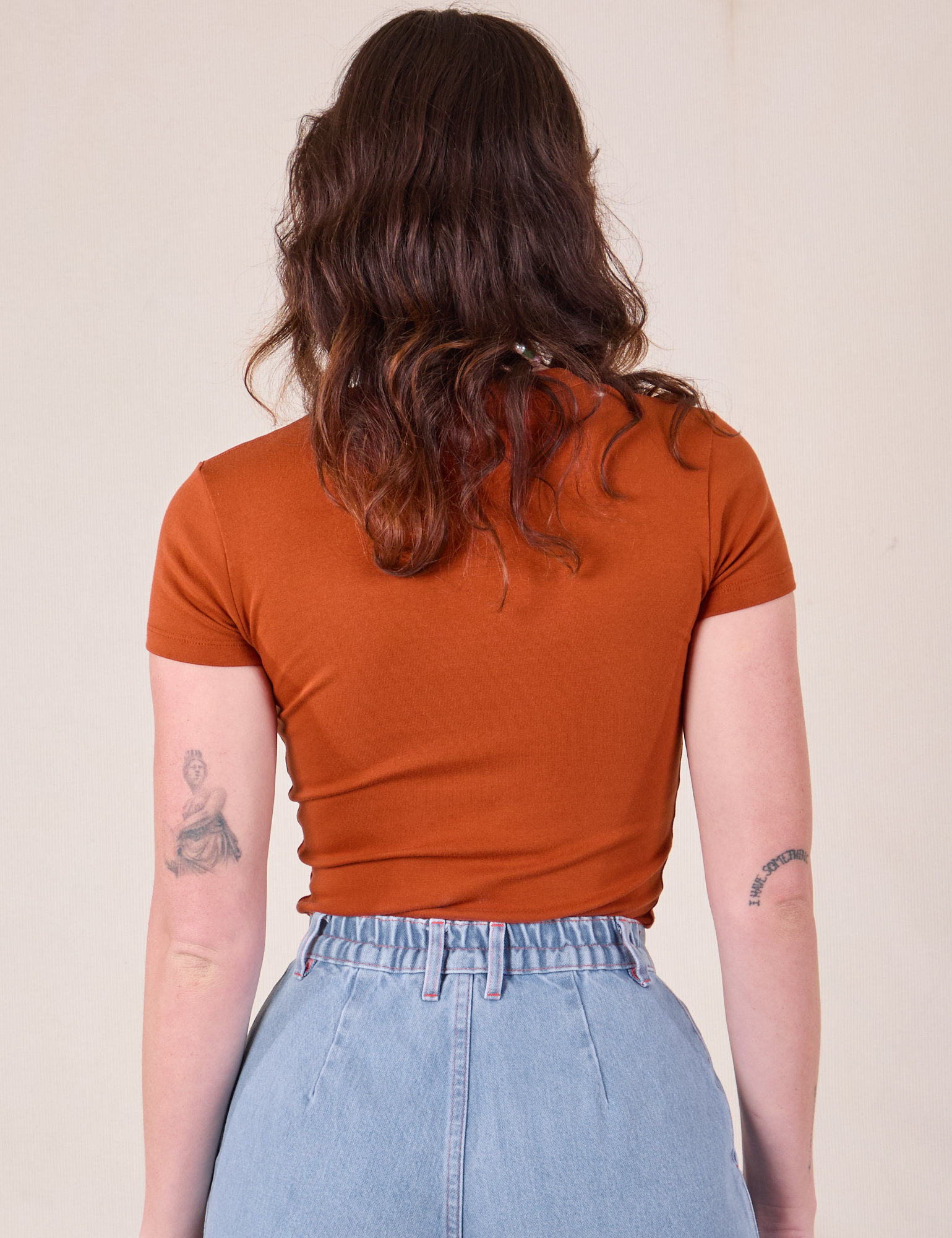 Baby Tee in Burnt Terracotta back view on Alex