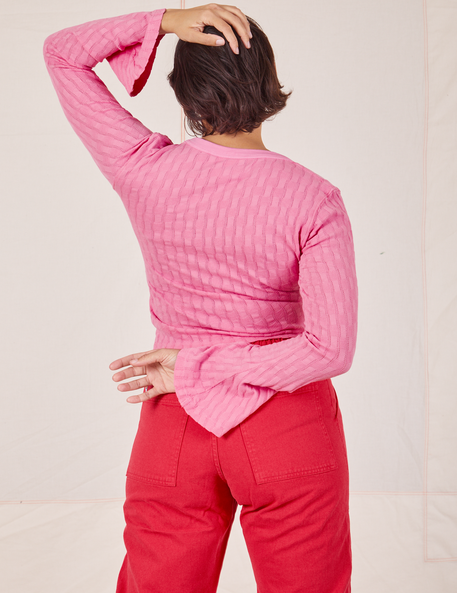 Back view of Bell Sleeve Top in Bubblegum Pink worn by Tiara