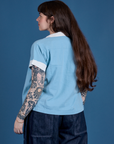 Painted Pantry Button-Up in Baby Blue angled back view on Sydney