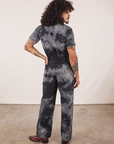 Back view of Short Sleeve Jumpsuit in Black Magic Waters worn by Jesse