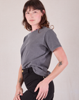 Burly Tee in Washed Grey angled front view tucked into pants on Alex