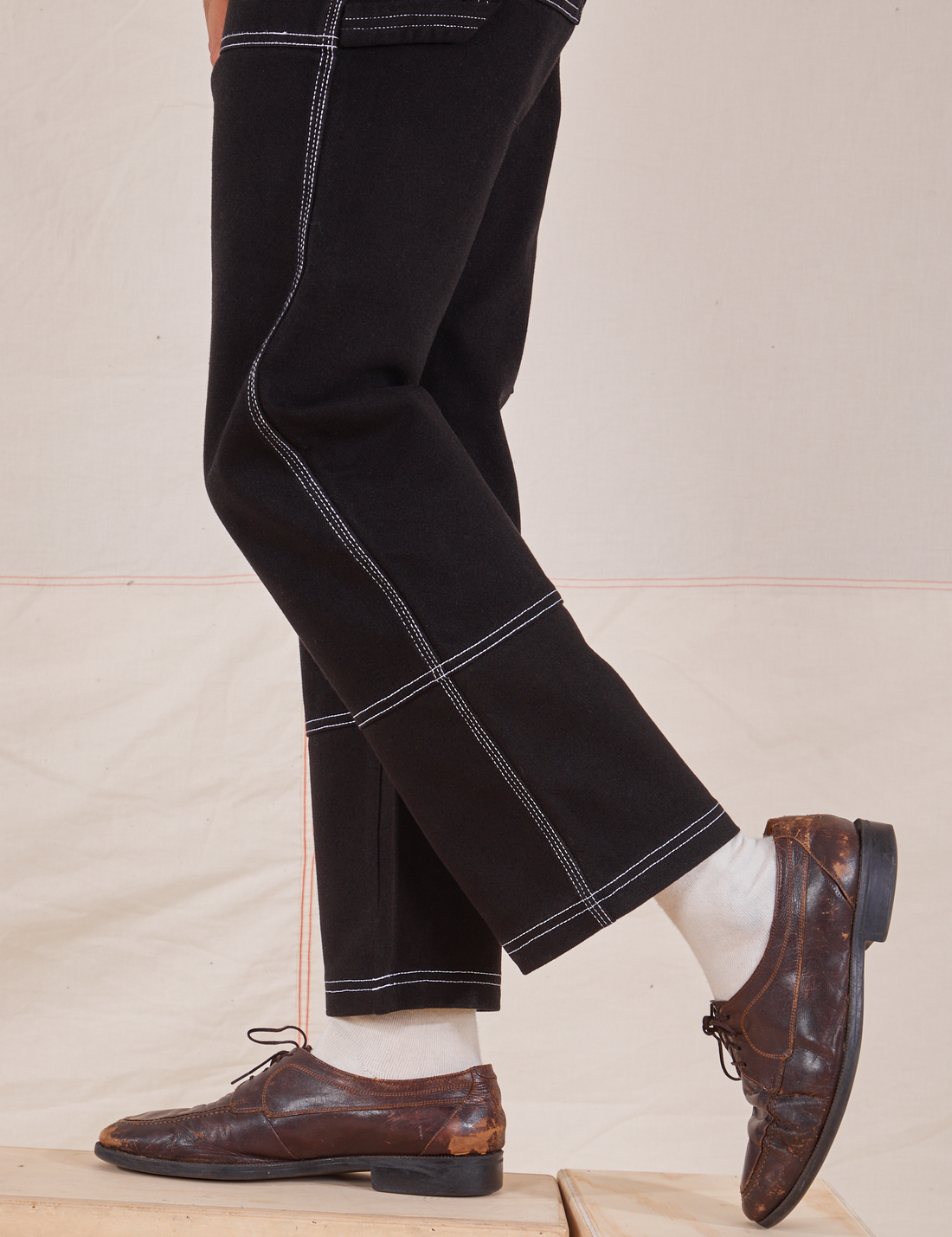 Carpenter Jeans in Black pant leg side close up