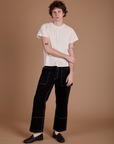 Quinn is wearing Carpenter Jeans in Black and the Organic Vintage Tee in Vintage Tee Off-White