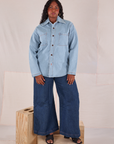 Meghna is wearing Denim Overshirt in Light Wash paired with dark wash Wide Leg Trousers