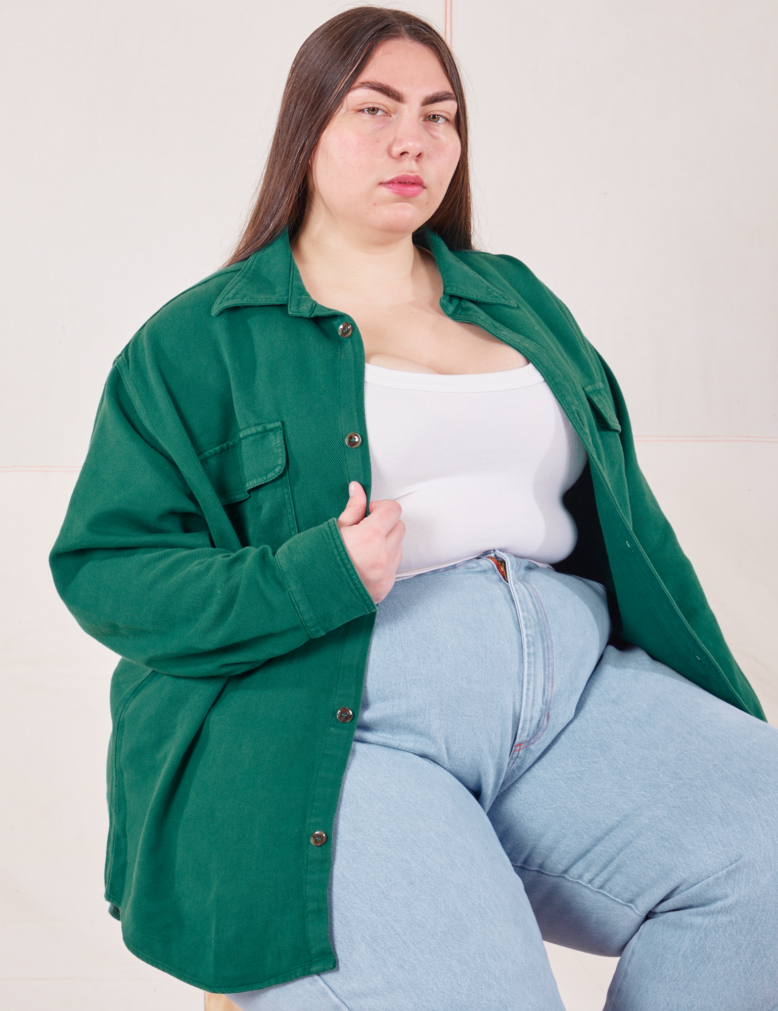 Marielena is wearing Flannel Overshirt in Hunter Green, vintage off-white Cropped Tank Top and light wash Trouser Jeans