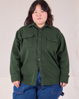 Ashley is wearing a buttoned up Flannel Overshirt in Swamp Green