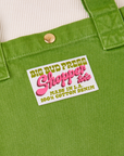 Sun baby brass snap on Shopper Tote Bag in Bright Olive. Bag label with green and pink text that reads "Big Bud Press Shopper Tote, Made in L.A., 100% Cotton Denim on white background