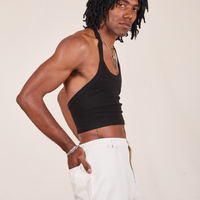 Side view of Halter Top in Basic Black and vintage off-white Western Pants worn by Jerrod