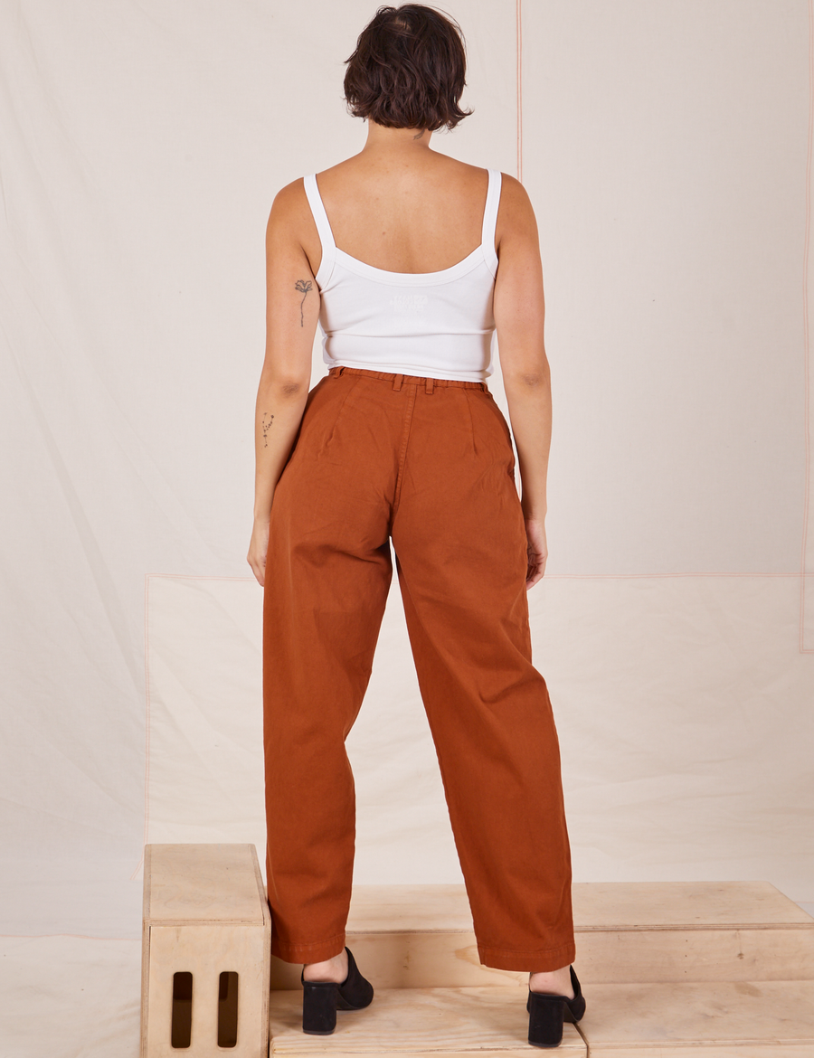 Back view of Heavyweight Trousers in Burnt Terracotta and vintage off-white Cropped Cami worn by Tiara