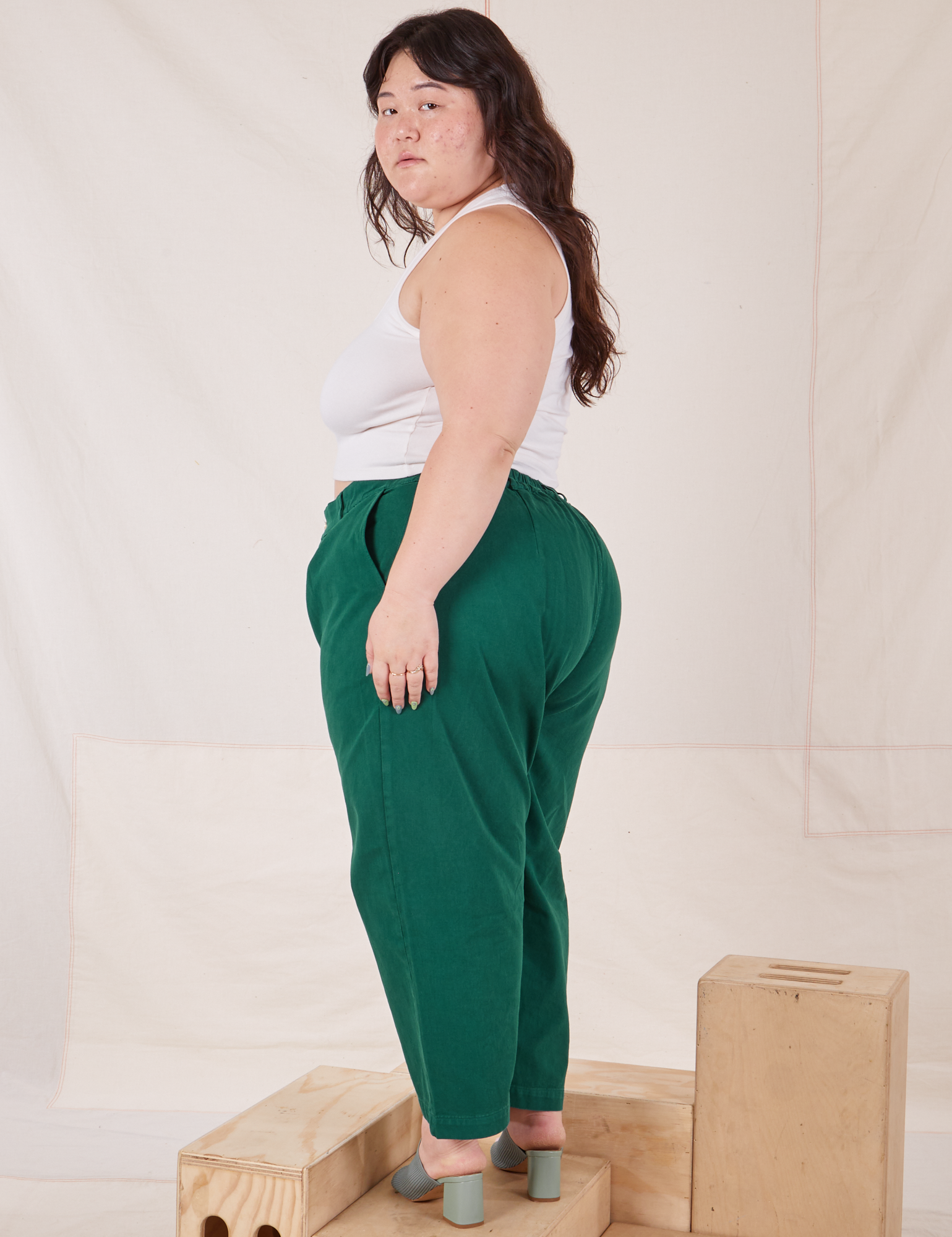 Side view of Heavyweight Trousers in Hunter Green worn by Ashley