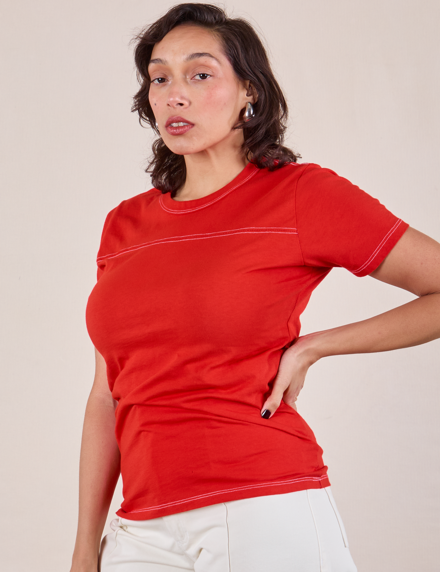 JV Tee in Mustang Red angled front view on Tiara