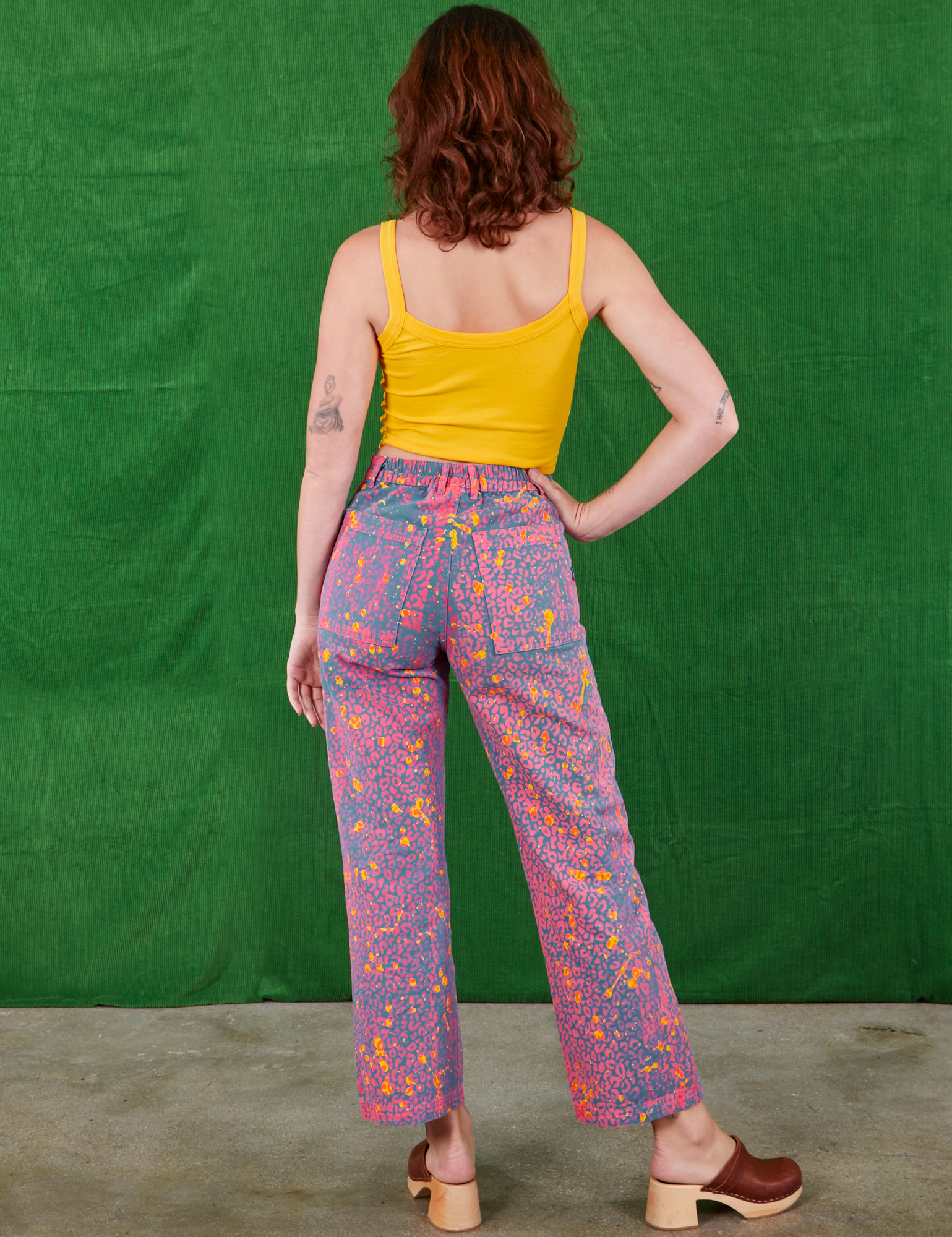 Back view of Work Pants in Electric Leopard and sunshine yellow Cami on Alex