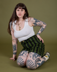 Sydney is wearing Longline Work Shorts in Evergreen and vintage tee white Cropped Tank