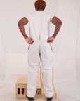 Back view of Mid-Rise Pleated Trousers in Stone White and Organic Vintage Tee in vintage tee off-white on Issac