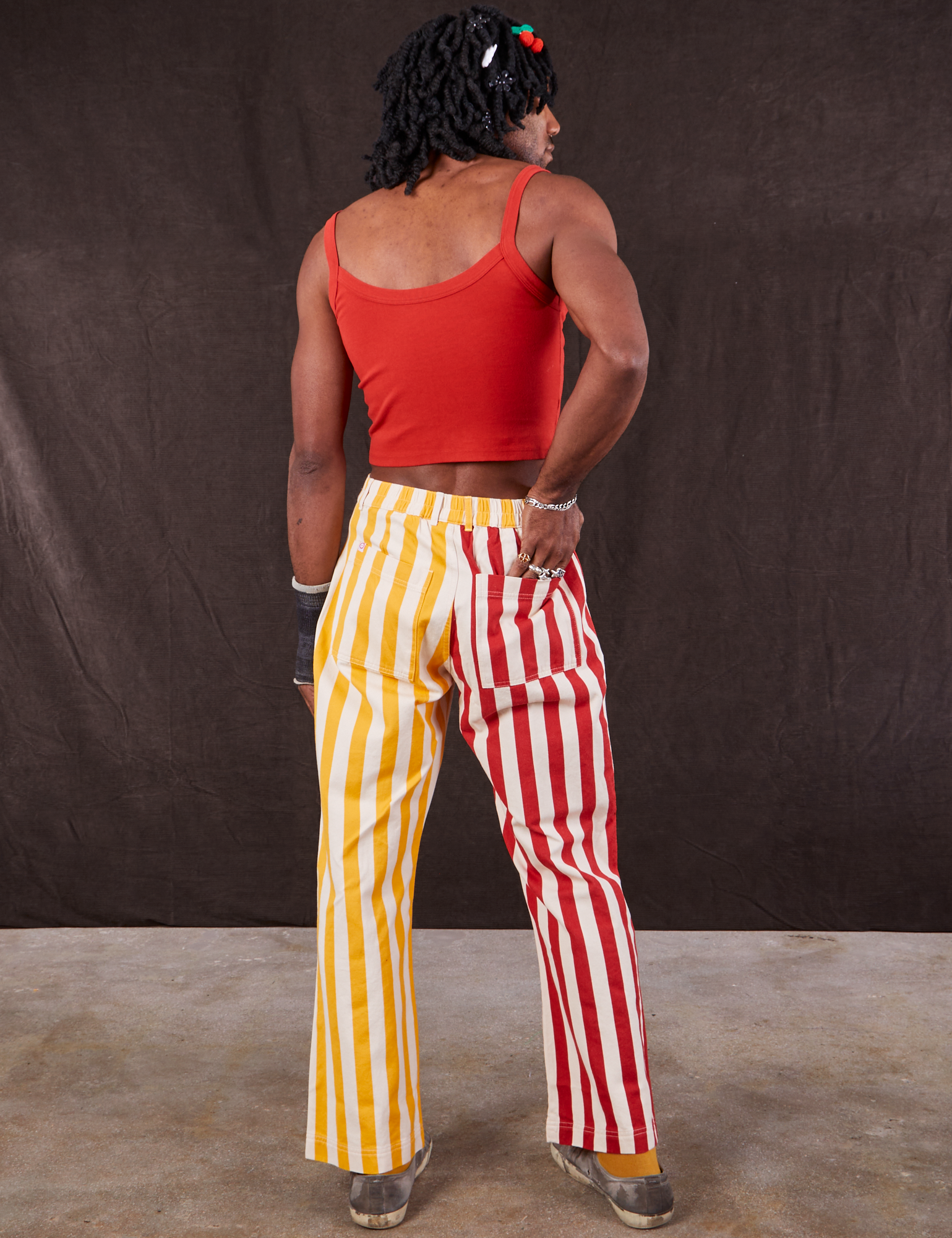 Back view of Western Pants in Ketchup/Mustard Stripes and mustang red Cami on Jerrod
