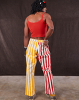 Back view of Western Pants in Ketchup/Mustard Stripes and mustang red Cami on Jerrod