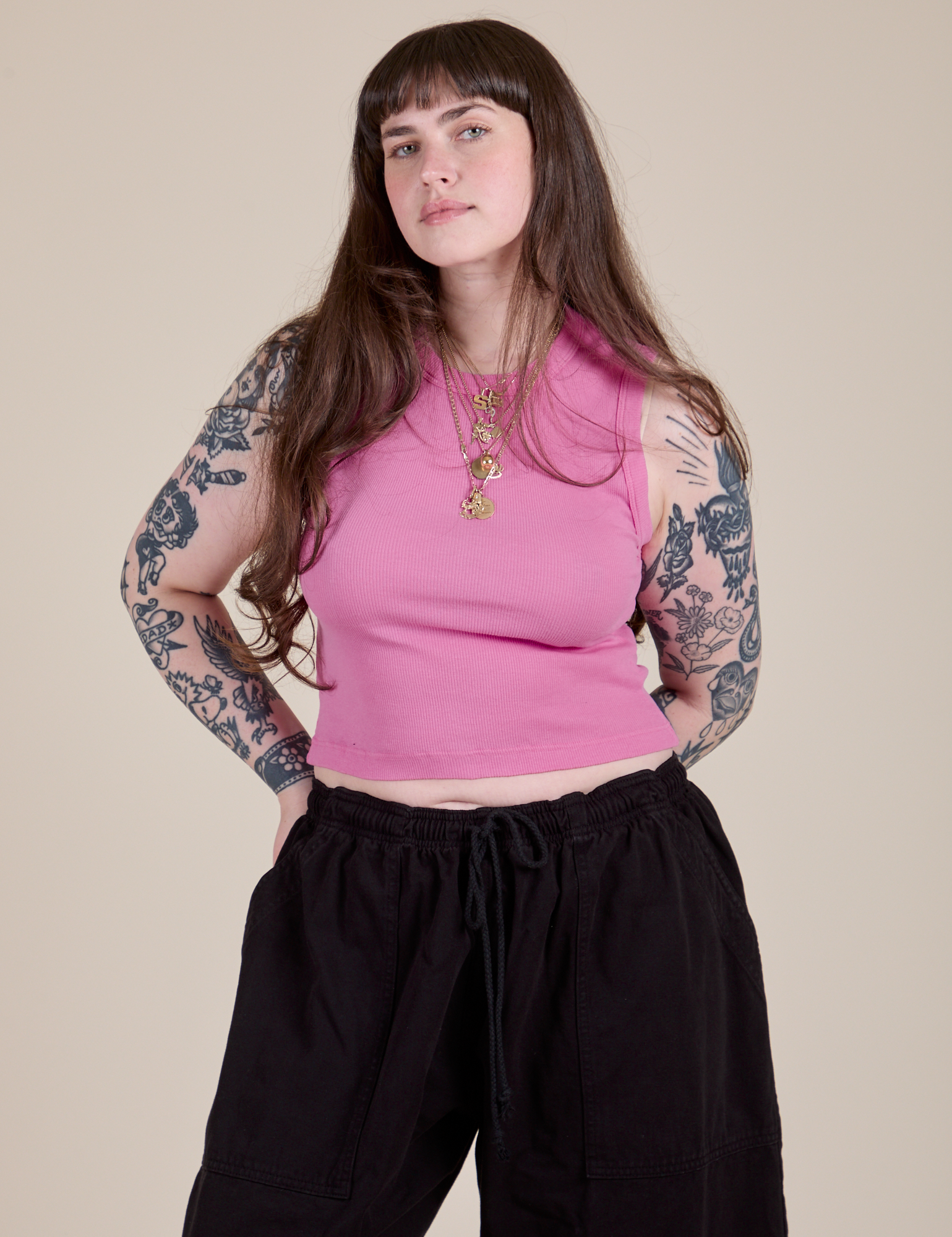 Sydney is 5'9" and wearing XXS Muscle Tee in Bubblegum Pink