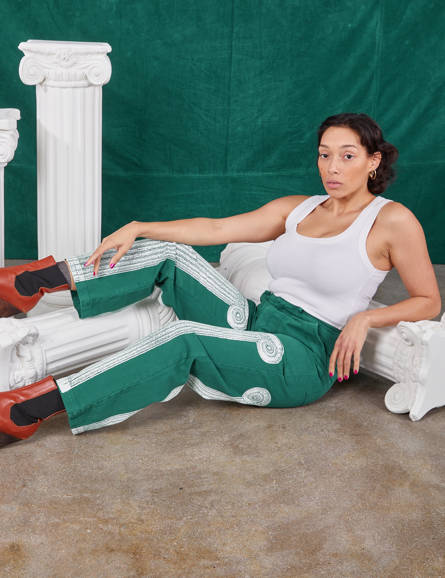 Tiara is wearing Column Work Pants in Hunter Green and vintage off-white Cropped Tank Top