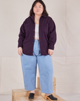 Ashley is wearing Oversize Overshirt in Nebula Purple and light wash Trouser Jeans