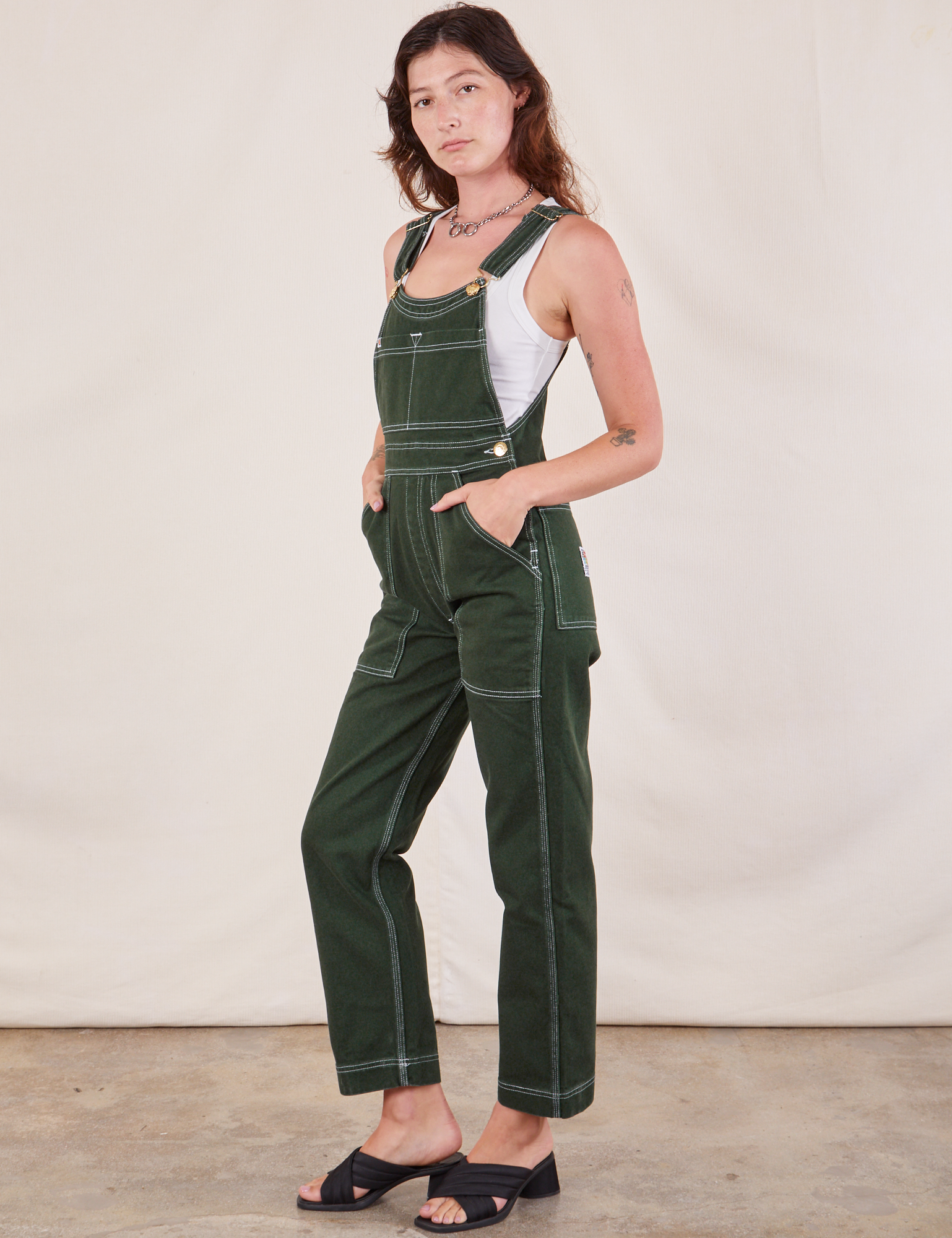 Original Overalls in Swamp Green angled front view on Alex