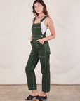 Original Overalls in Swamp Green angled front view on Alex