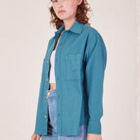 Angled view of Oversize Overshirt in Marine Blue worn by Alex