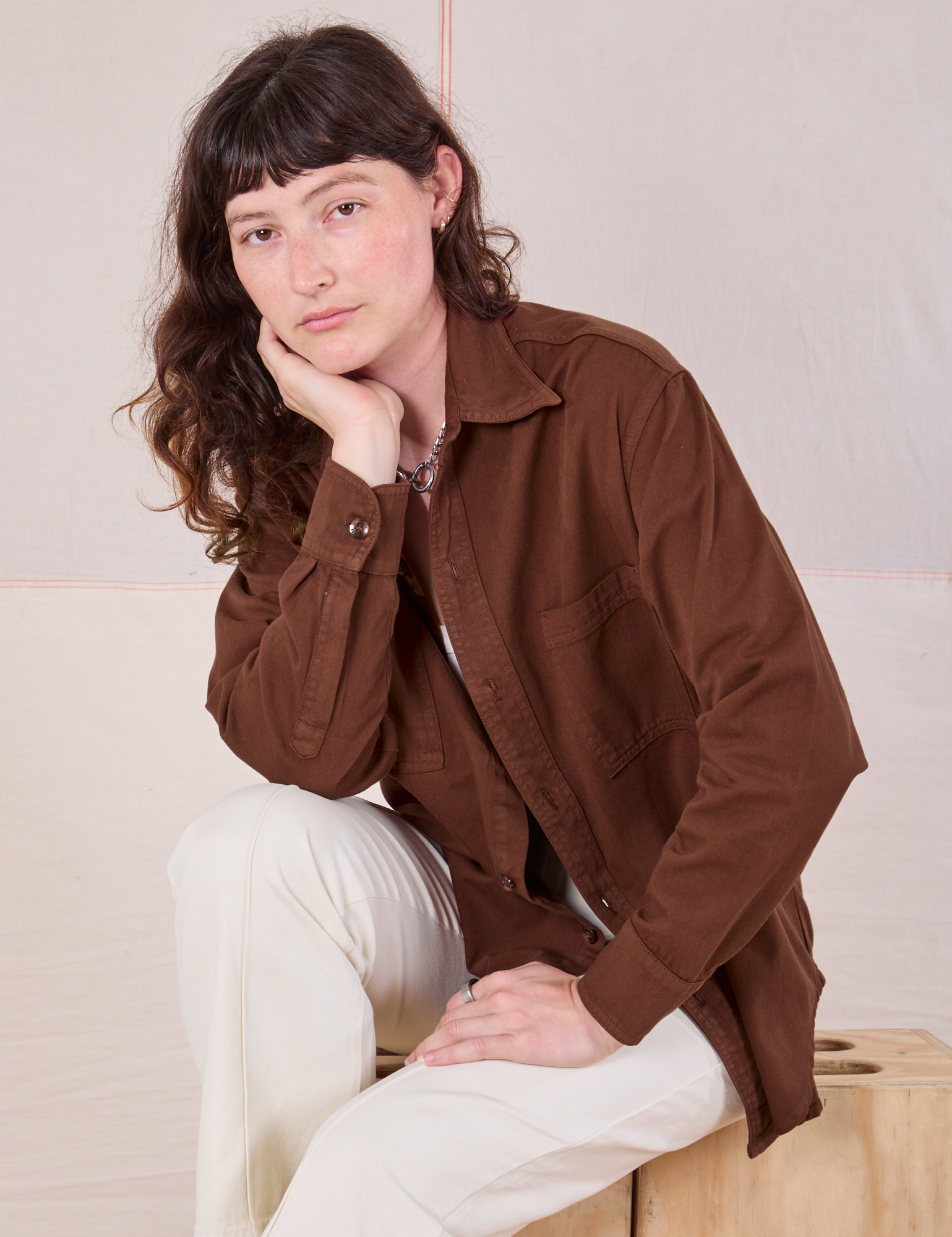 Alex is wearing Twill Overshirt in Fudgesicle Brown